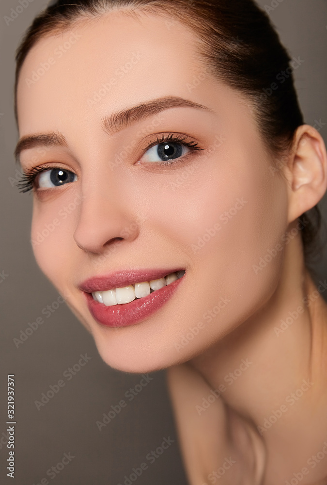 Portrait of a young pretty brunette with blue eyes close-up. Portrait of a young pretty brunette with blue eyes close-up.