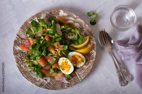 Salmon egg radish and lamb leaves salad. Healthy diet food. View from above  top view