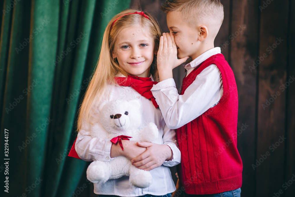 Happy kids with red heart balloon isolated on white background. child boy and girl want . St. Valentine's Day. Boy and girl made paper valentines. Happy kids with red heart balloon isolated on white background. child boy and girl want . St. Valentine's Day. Boy and girl made paper valentines.