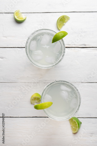 Mexican lime margarita cocktail on white background