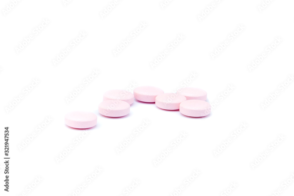 Pink pills macro isolated on white background Pink pills macro isolated on white background