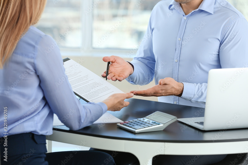 Bank manager working with man in office Bank manager working with man in office