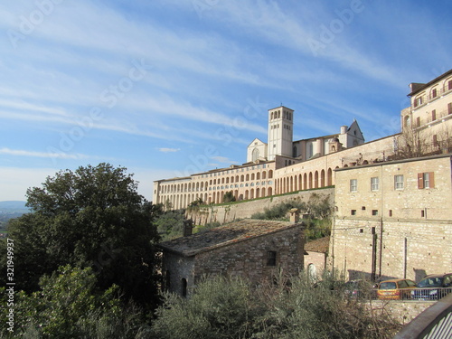 View of the Basilica of Saint Francis of Assisi on the hill in Assisi  Italy on a sunny day