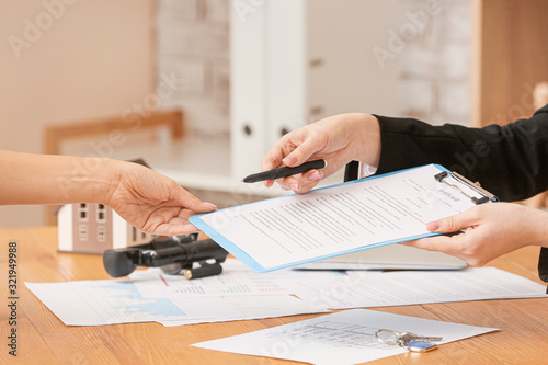 Real estate agent working w...