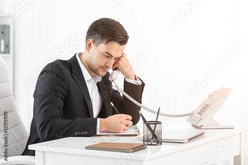 Handsome businessman workin...