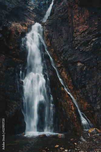 large waterfall running down rocks