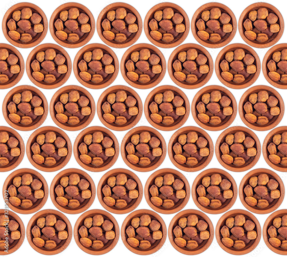 Dried apricots in a ceramic bowl isolated on white background. Dried apricots in a ceramic bowl isolated on white background.