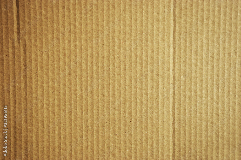 Brown cardboard detail and texture with vertical flutes Brown cardboard detail and texture with vertical flutes