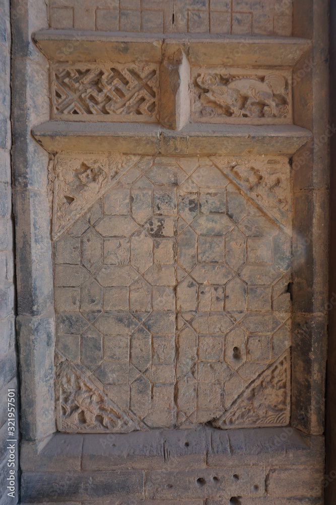 The decorations on the walls of ancient buildings