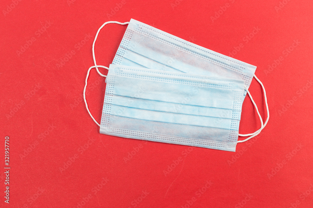 A close-up shot of a disposable surgical mask A close-up shot of a disposable surgical mask