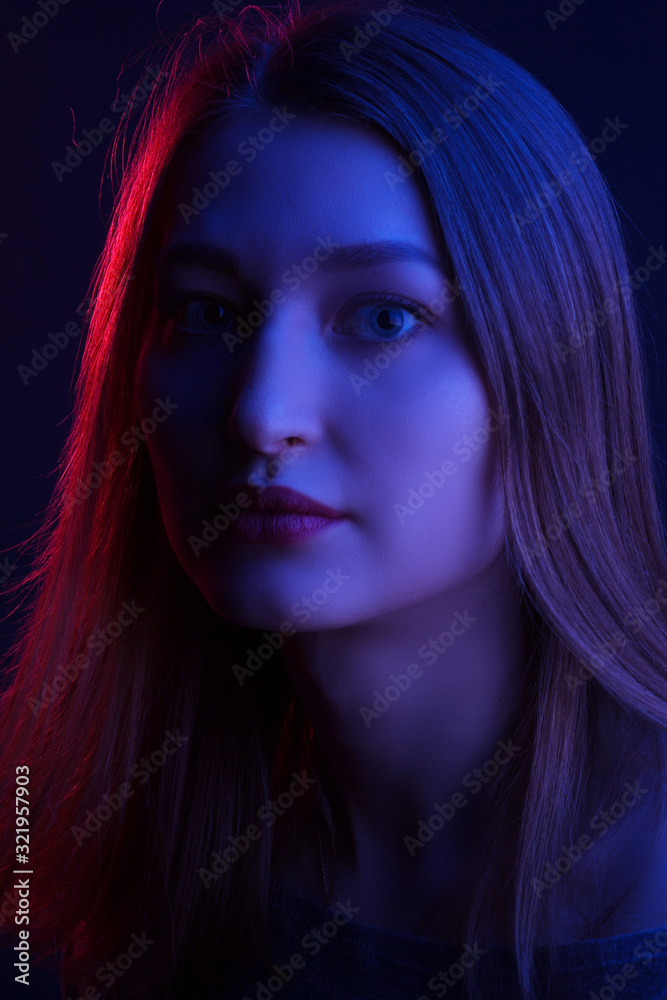 Fashionable Artistic Portrait Of A Beautiful Female Model In Bright Lights