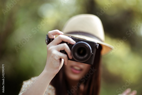 Say cheese!! - abstract picture of young woman taking your picture