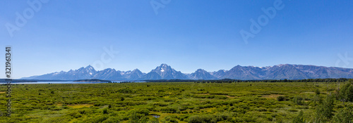 Grand Teton range in Grand Teton National Park. Grand Teton National Park is in Wyoming, USA. Also, Grand Teton range is a range of mountains part of the US Rockies.