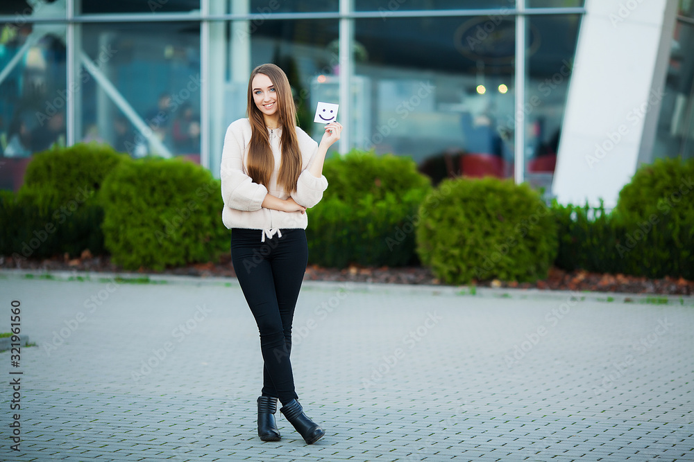 Beautiful woman holding cards with funny smile Beautiful woman holding cards with funny smile