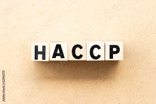 Letter block in word HACCP (Hazard Analysis Critical Control Points) on wood background © bankrx