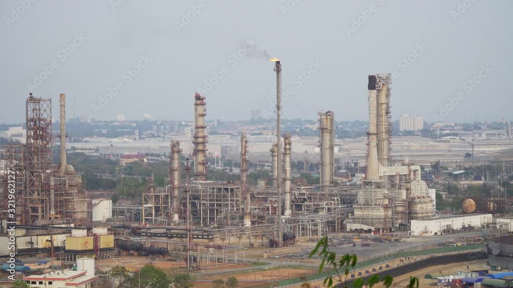 Power plant Billowing steam from smoke stack filling sky. Smoking chimneys from factory. Chimneys of power plant or oil refinery at Sunrise polluting environment. Air Pollution Concept. footage B roll Power plant Billowing steam from smoke stack filling sky. Smoking chimneys from factory. Chimneys of power plant or oil refinery at Sunrise polluting environment. Air Pollution Concept. footage B roll