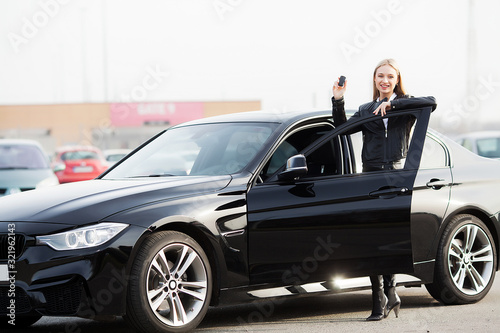 Young happy woman bought new modern car. © Maksymiv Iurii