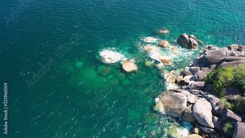 Footage B-roll of Aerial view drone shot ocean waves, Beautiful tropical beach and rocky coastline and beautiful forest. Nga Khin Nyo Gyee Island Myanmar. Tropical seas and islands in southern Myanmar photo