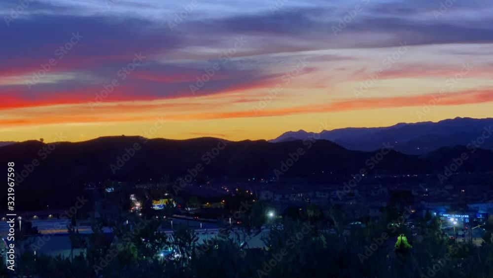 Vibrant sunset time lapse above cityscape of Santa Clarita, California Vibrant sunset time lapse above cityscape of Santa Clarita, California