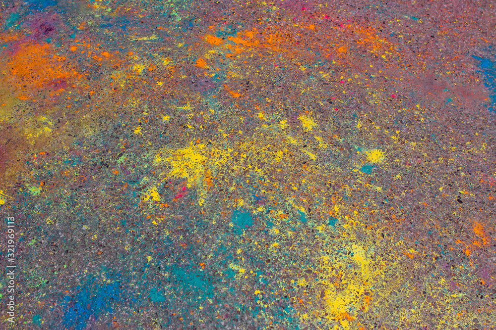 Background of colorful Holi powder on the ground Background of colorful Holi powder on the ground