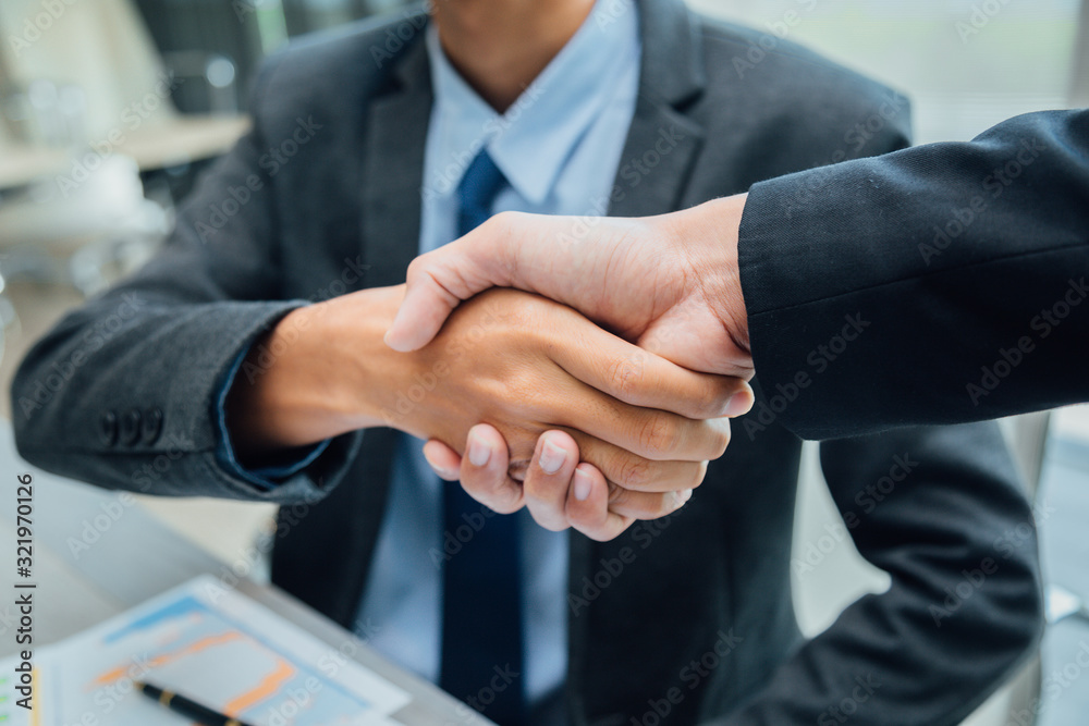 Fototapeta premium Concept of partnership - handshake business partners Successful team leader entrepreneurship .