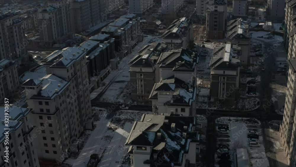 Aerial tilting up shot to reveal rows and rows of identical Eastern Bloc housing in Communist state. 4K Aerial tilting up shot to reveal rows and rows of identical Eastern Bloc housing in Communist state. 4K