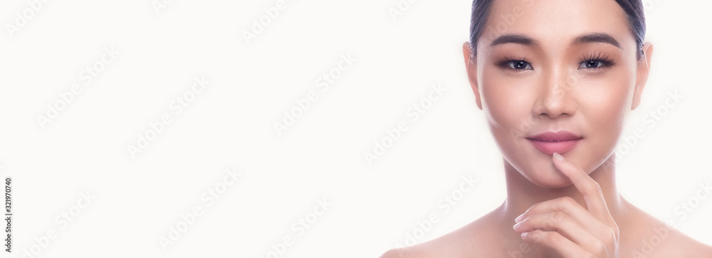 Beautiful Young Asian Woman with Clean Fresh Skin isolate on white background. Spa, Face care, Facial treatment, Beauty and Cosmetics concept. Finger on lips, smile. Banner frame. Beautiful Young Asian Woman with Clean Fresh Skin isolate on white background. Spa, Face care, Facial treatment, Beauty and Cosmetics concept. Finger on lips, smile. Banner frame.