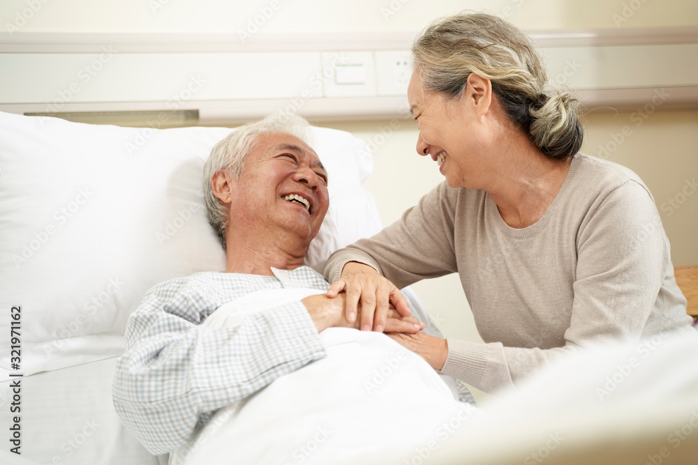 asian senior woman visiting husband in hospital