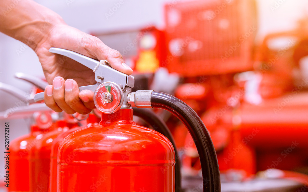 Close up Fire extinguisher and pulling pin on red tank. Close up Fire extinguisher and pulling pin on red tank.
