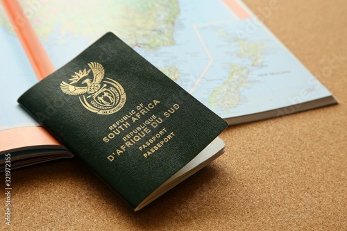 Billede på lærred Hand holding South African passport. Emigration concept image.