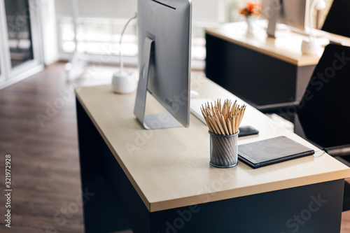 Minimal office workplace modern style. Wooden desk with pencil. photo