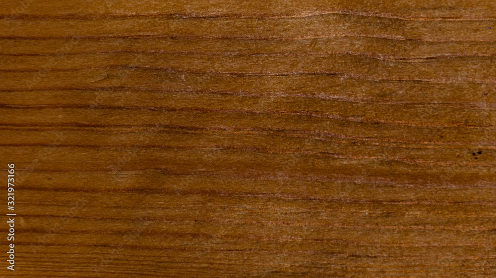 Dark brown wood texture background close-up shot from the table-top Dark brown wood texture background close-up shot from the table-top
