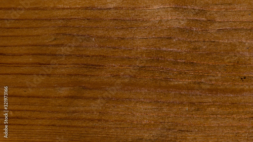 Dark brown wood texture background close-up shot from the table-top