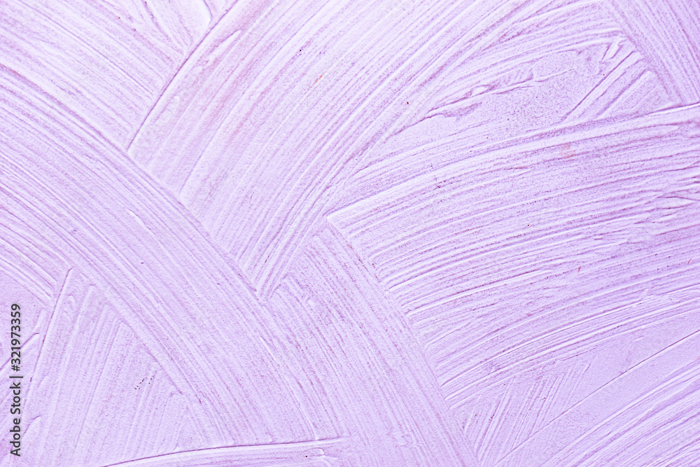 A close-up texture background of a distressed relief light bright purple wall painted with wide strokes