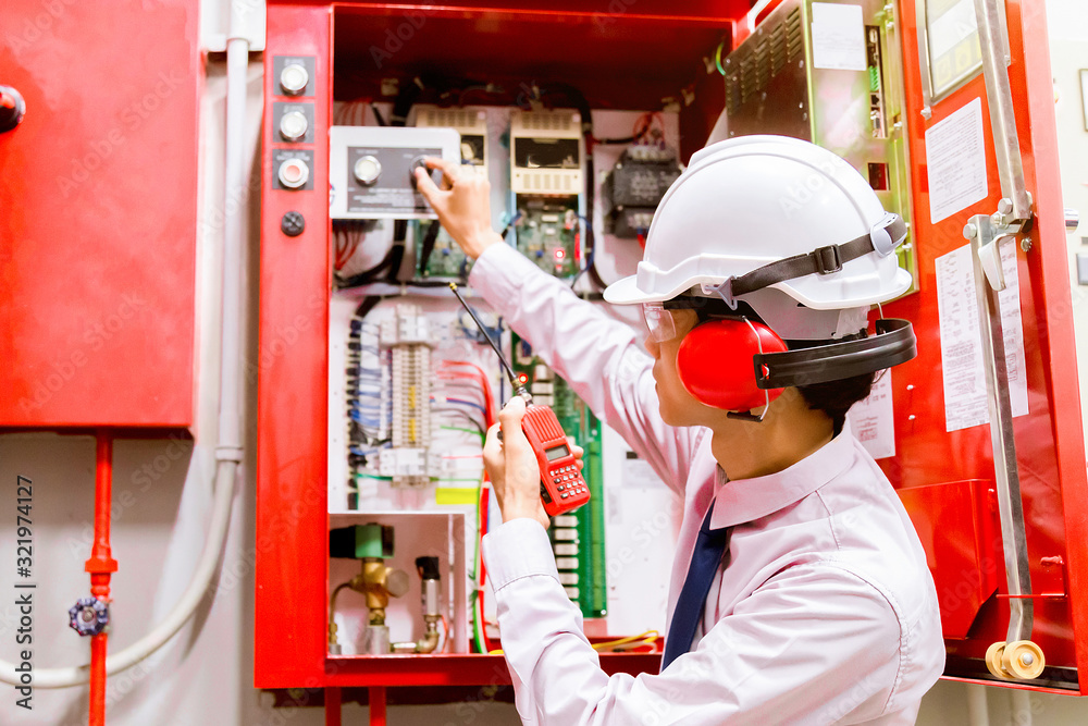 Engineer checking Industrial fire control system,Fire Alarm controller