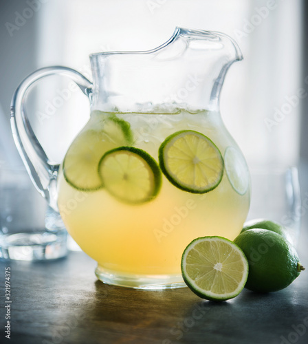 Pitcher of margaritas with lime photo