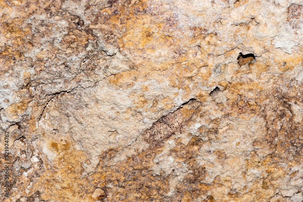 A grunge texture background of an old stone relief wall A grunge texture background of an old stone relief wall