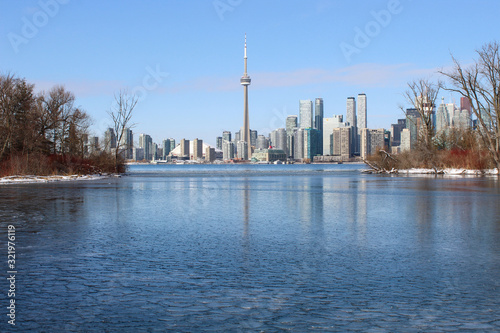 City skyline with frozen lake in winter