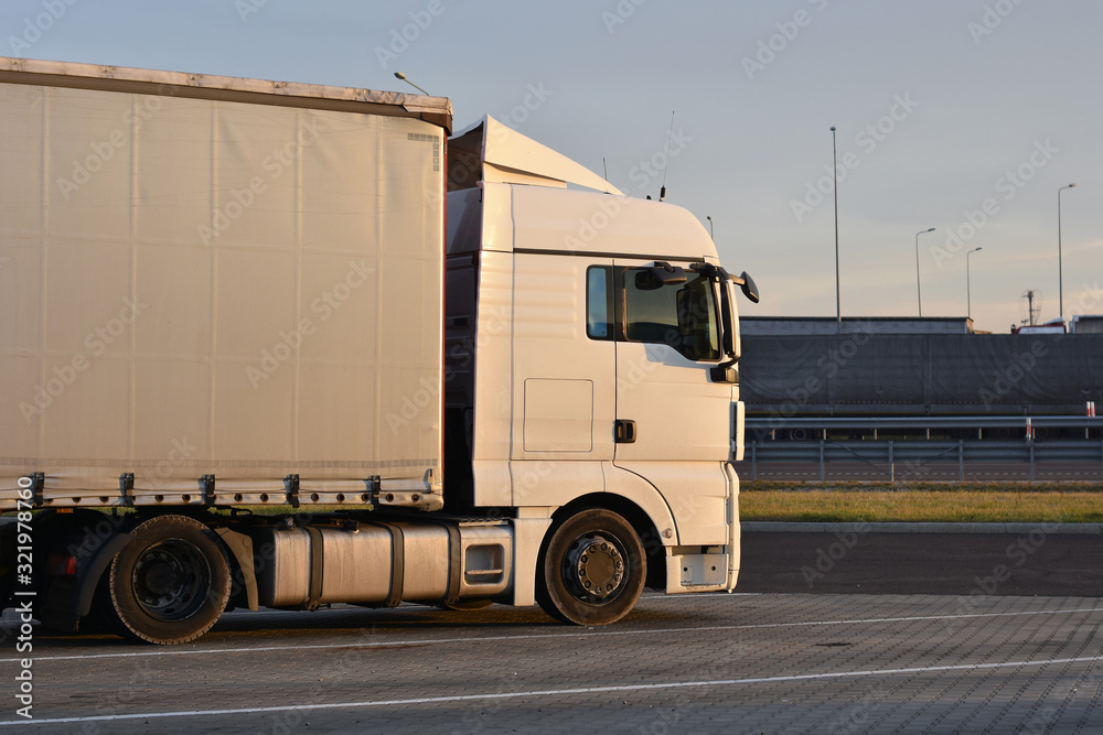 Side view of a truck standing for rest at parking lot. Side view of a truck standing for rest at parking lot.