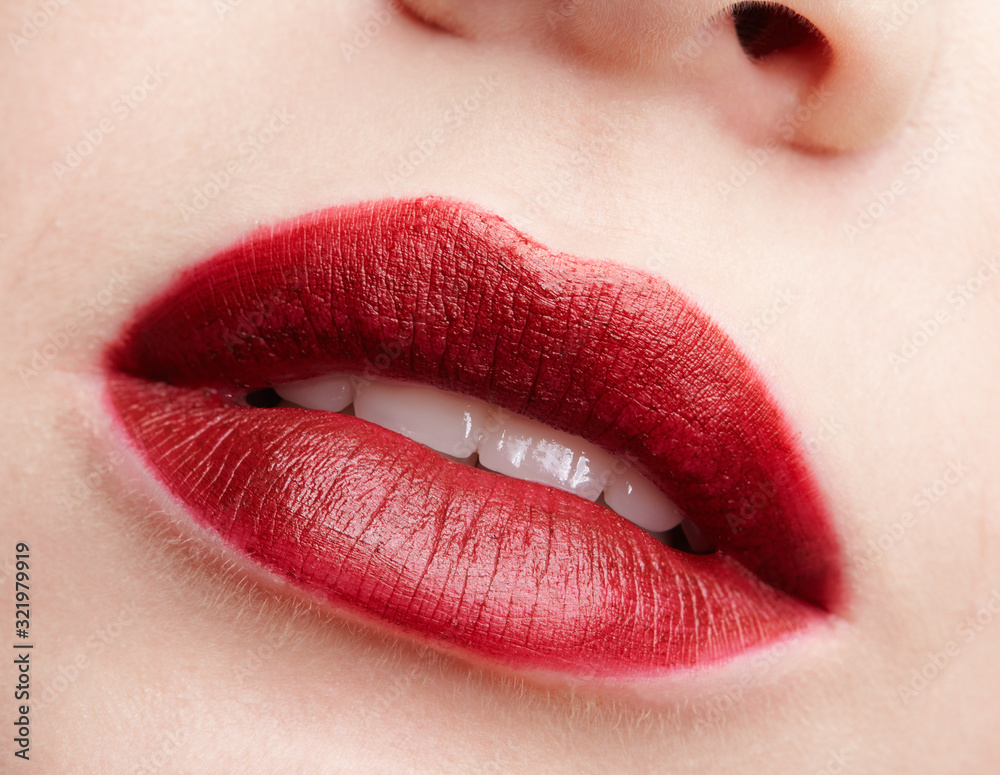 Closeup macro portrait of female red smiling lips with day beauty makeup. Closeup macro portrait of female red smiling lips with day beauty makeup.