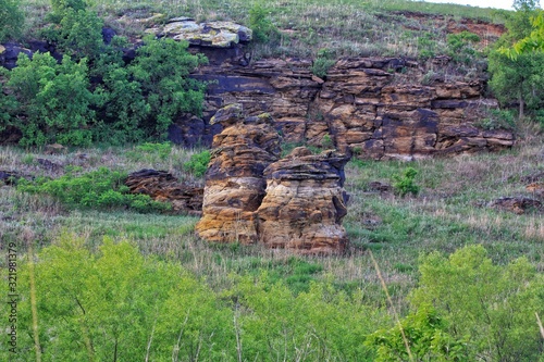 Colorful Rocks in a Pasture on Horsetheif Canyon Road at Kanopolis Lake Kansas USA. photo
