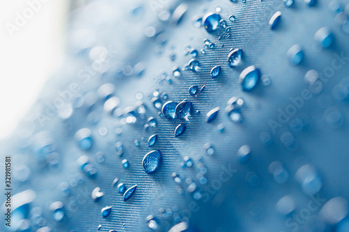  Water droplets on a waterproof fabric blue background