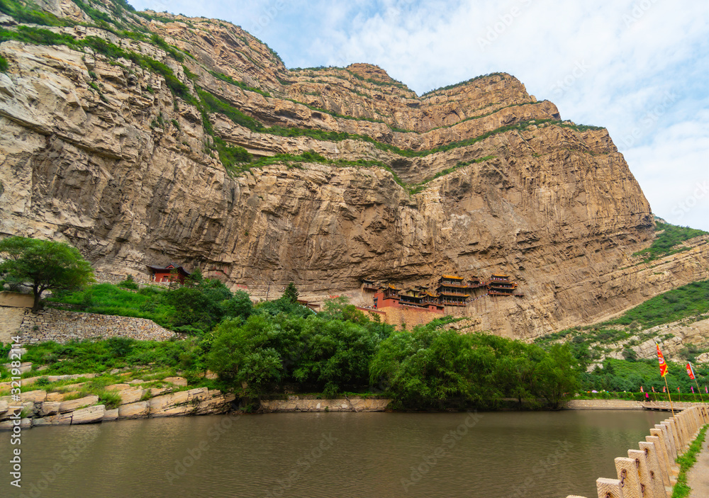 Landscape panorama of Xuankong Monastery  (chinese Hanging Temple) in Mount Heng over the river, Shanxi province, China. 