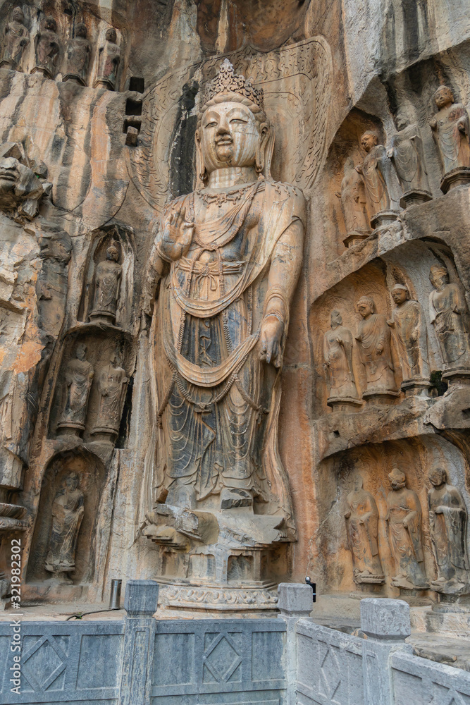 Big Bodhisattvas statue made in tang dynasty. The figure is the king of heaven, Fengxian main cave. Longmen Grottoes in Luoyang, Henan province, China