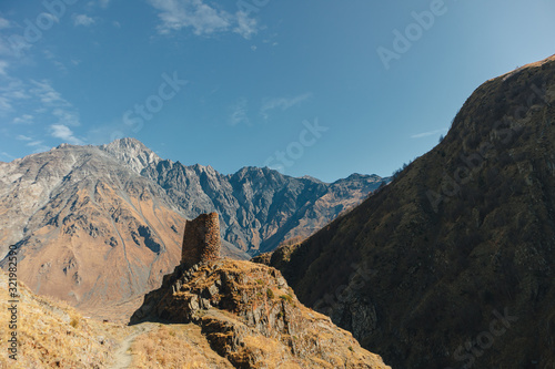 Landscape of Gergeti tower ruins on mount Kazbek trail in Stepansminda, Kazbegi, Georgia.