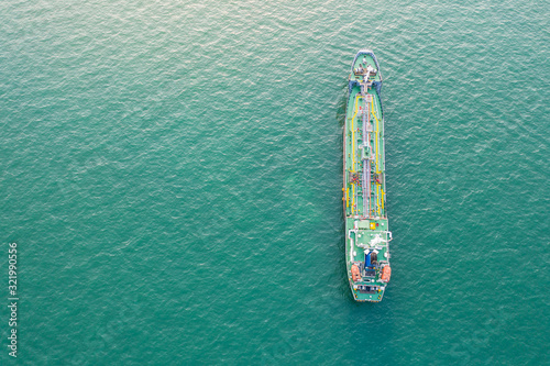 Aerial top view of the ship carrying the LPG and oil tanker in the sea port with vessel logistics. For energy export and import business for transportation trade. © Love You Stock