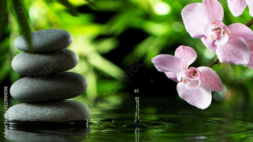 Dripping drops of water with black lava stones