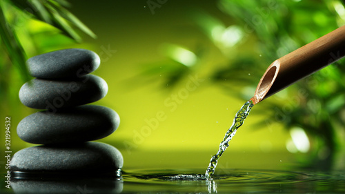 Photography A stream of water flowing out of bamboo tube