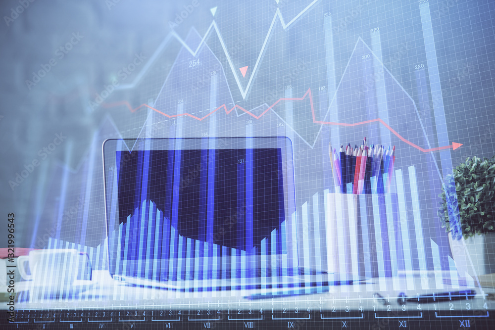 Financial graph colorful drawing and table with computer on background. Multi exposure. Concept of international markets. Financial graph colorful drawing and table with computer on background. Multi exposure. Concept of international markets.