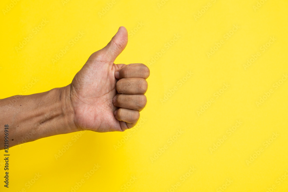 Malay or latin hand on yellow background. 